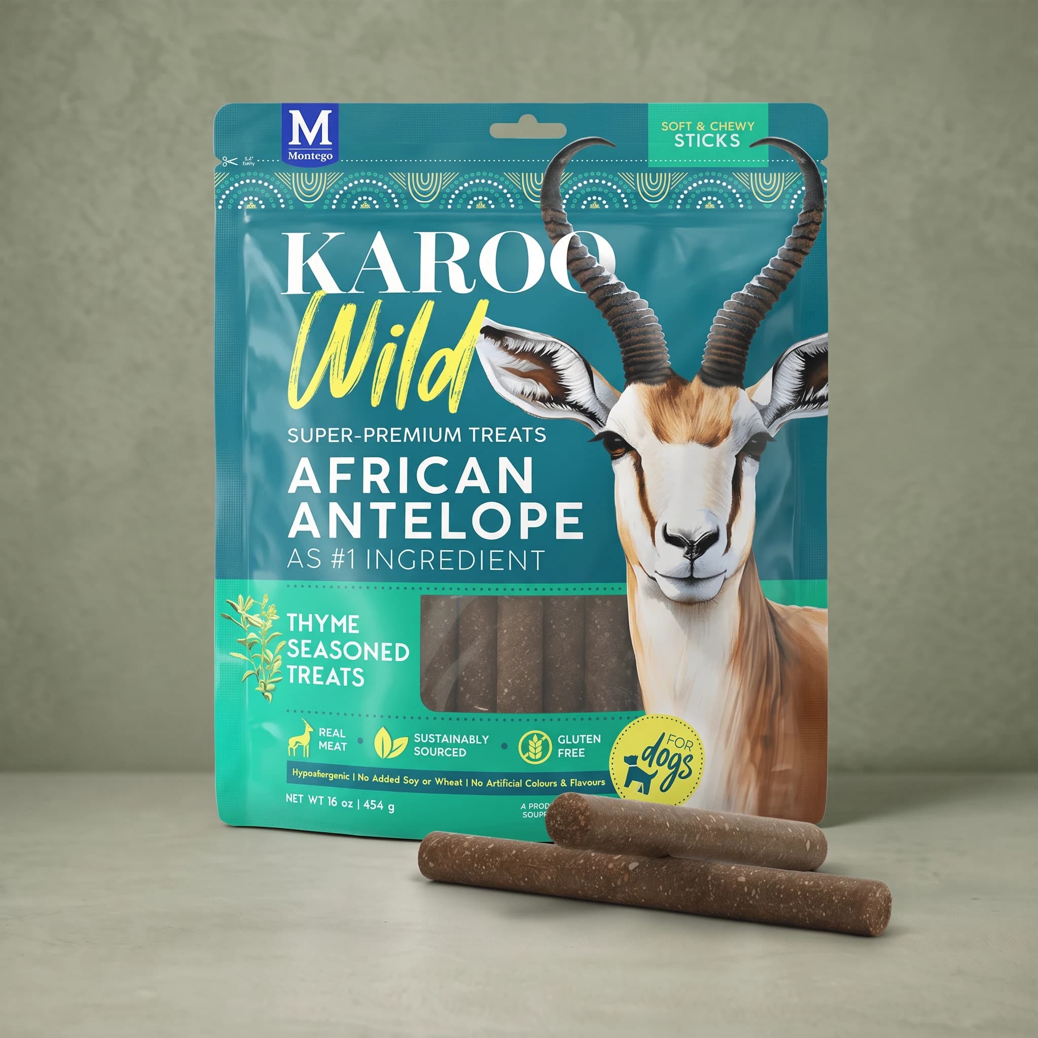 The same teal and green Karoo Wild Thyme Sticks pouch standing upright against a plain sage green background, with two dark brown chewy sticks crossed at its base.