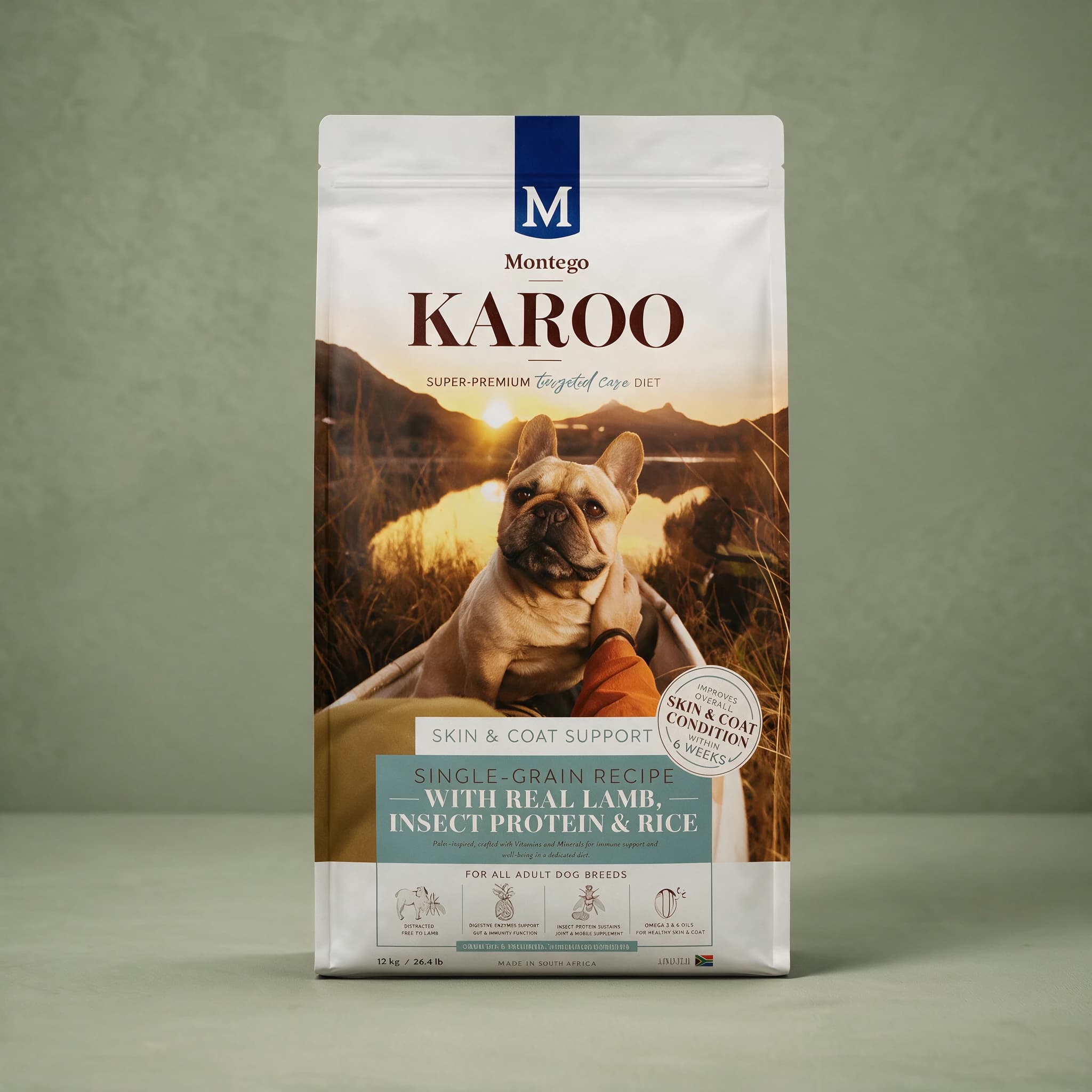 A white stand-up pouch of Montego Karoo dry dog food with a navy "M" Montego logo and brown "KAROO" wordmark, labelled "Targeted Care — Skin and Coat Support," showing a lifestyle photo of a dog with its owner outdoors and a banner reading "Real Lamb, Insect Protein & Rice," standing alone against a