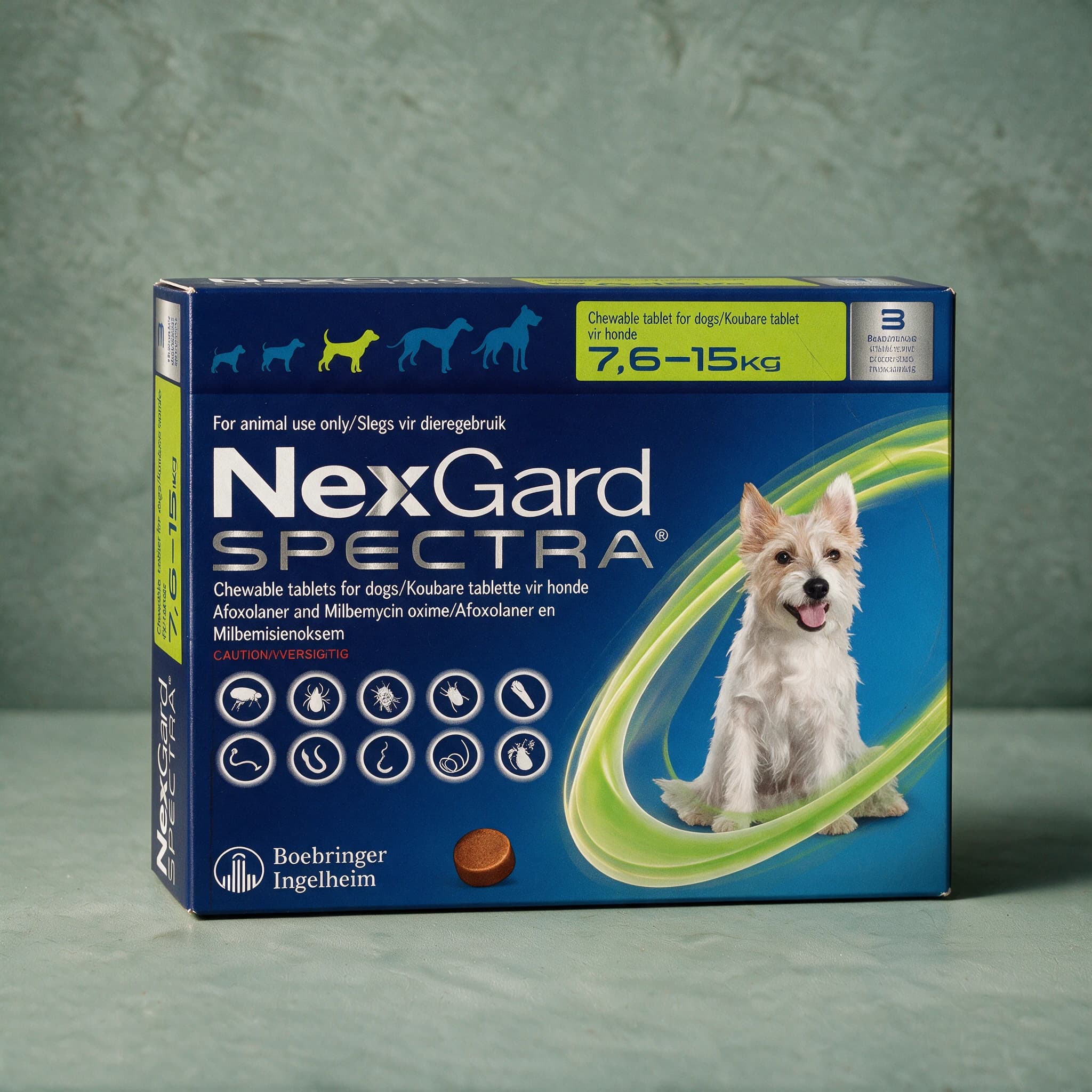 Green and navy box of NexGard Spectra Chewable Tablets for Dogs, 7.6-15kg pack, with the NexGard Spectra logo, Terrier dog picture and flea/tick/worm icon row on the front panel.
